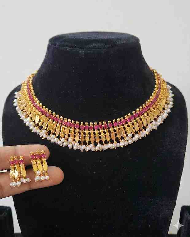 1780829687978 Goldlookalike Ruby Stone Elakkathali Necklace Set - Image 1